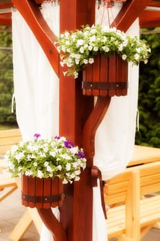 Hanging wooden flower arrangement at the entrance, note shallow depth of field