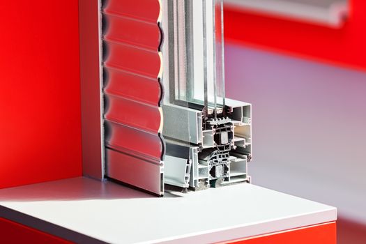 lateral cross-section aluminum frame windows with  mehanism for shutters, note shallow depth of field