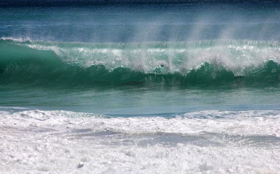Big wave crashes on to the shore. Indian ocean