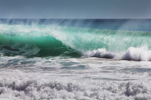 Big wave crashes on to the shore. Indian ocean