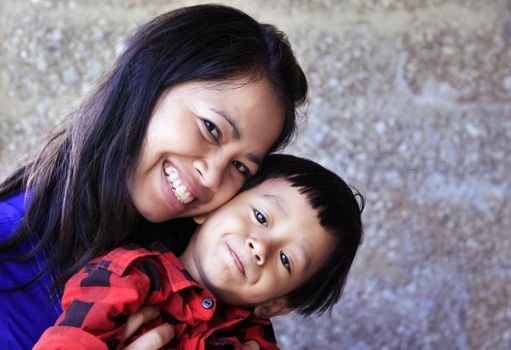 Young happy asian mother and her son