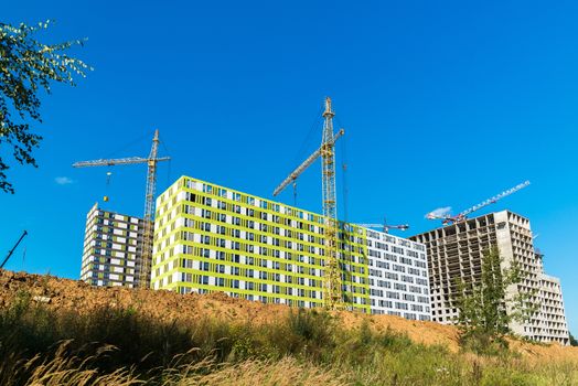 Construction of apartment houses of different architecture in Moscow, Russia