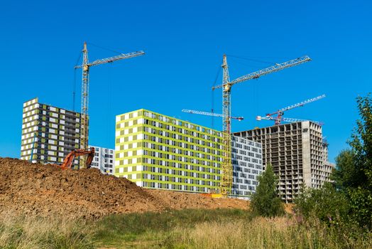 Construction of apartment houses of different architecture in Moscow, Russia