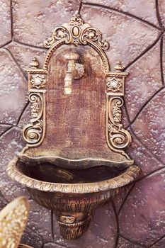 decorative fountain  made of wrought iron, note shallow depth of field