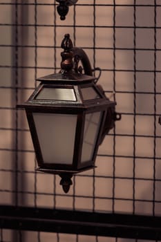 Decorative antique lantern made of wrought iron, note shallow depth of field