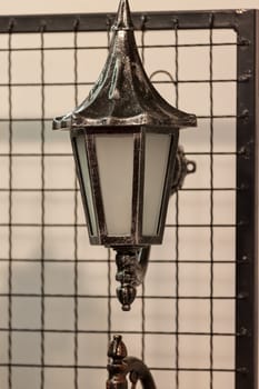 Decorative antique lantern made of wrought iron, note shallow depth of field