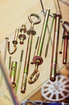 screws, nuts, clamps ...on the glass, note shallow depth of field