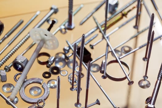 screws, nuts, clamps ...on the glass, note shallow depth of field