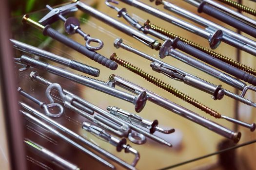 screws, nuts, clamps ...on the glass, note shallow depth of field