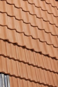 types of red tiles for roof  to cover the house, note shallow depth of field