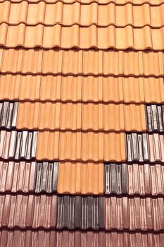 types of red tiles for roof  to cover the house, note shallow depth of field