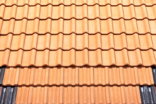 types of red tiles for roof  to cover the house, note shallow depth of field