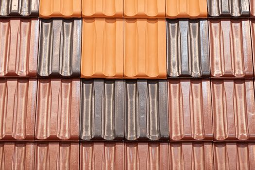 types of red tiles for roof  to cover the house, note shallow depth of field