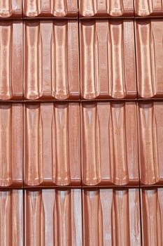 types of red tiles for roof  to cover the house, note shallow depth of field