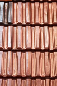 types of red tiles for roof  to cover the house, note shallow depth of field