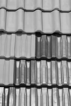 types of red tiles for roof  to cover the house, note shallow depth of field