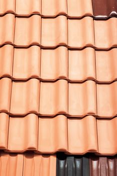 types of red tiles for roof  to cover the house, note shallow depth of field