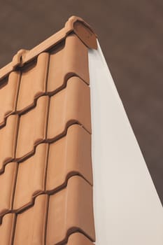 types of red tiles for roof  to cover the house, note shallow depth of field