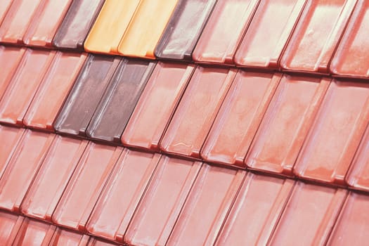 types of red tiles for roof  to cover the house, note shallow depth of field