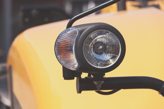 type headlights of the machine, note shallow depth of field