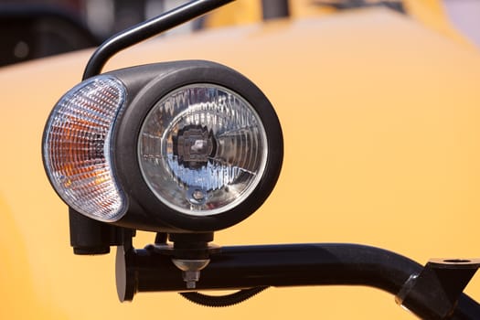 type headlights of the machine, note shallow depth of field