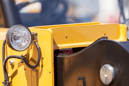 type headlights of the machine, note shallow depth of field