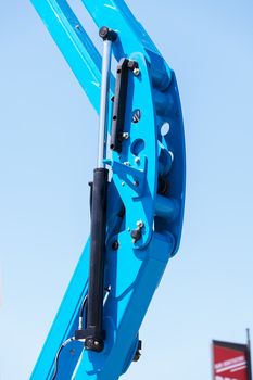 Details crane in construction on the blue background, note shallow depth of field