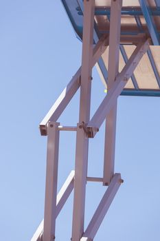 Details crane in construction on the blue background, note shallow depth of field