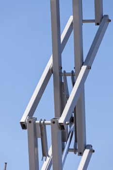 Details crane in construction on the blue background, note shallow depth of field