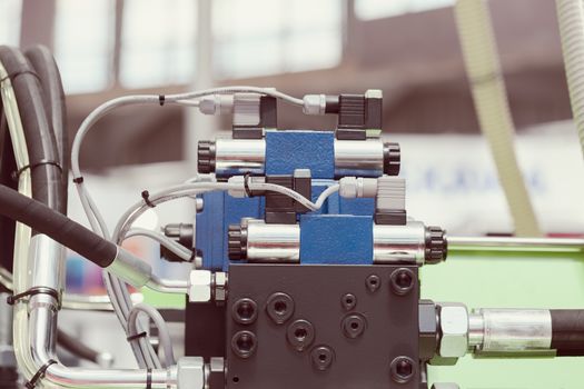 detail of metal processing machines on the blue background, note shallow depth of field