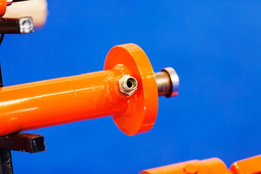 detail of metal processing machines on the blue background, note shallow depth of field