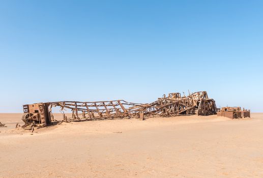 The rusted remains of an abandoned oil drilling rig between Henties Bay and Torra Bay in the Skeleton Coast area of Namibia