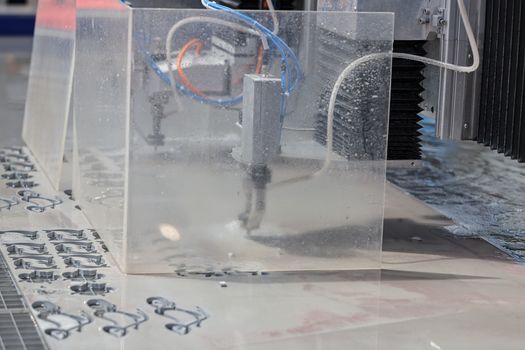 cnc water jet machine for  metalworking, note shallow depth of field