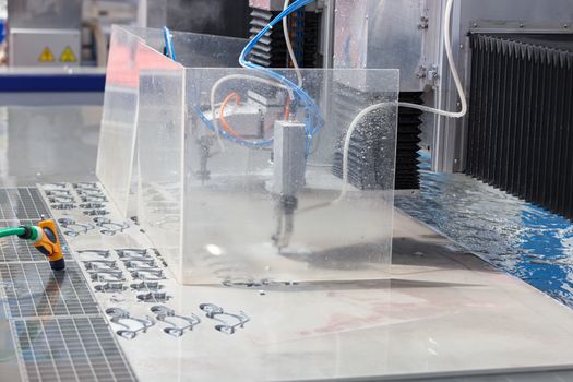 cnc water jet machine for  metalworking, note shallow depth of field