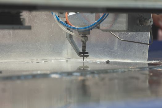 cnc water jet machine for  metalworking, note shallow depth of field