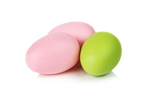Pink and green Easter eggs isolated on white background
