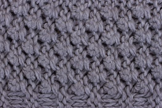 Gray knitting background texture. Knit woolen Fabric textile