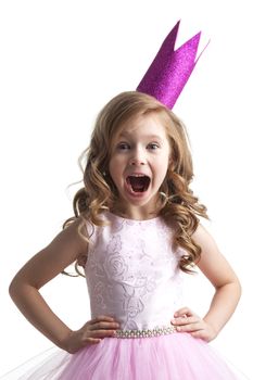 Little princess girl in pink crown and beautiful dress on white background