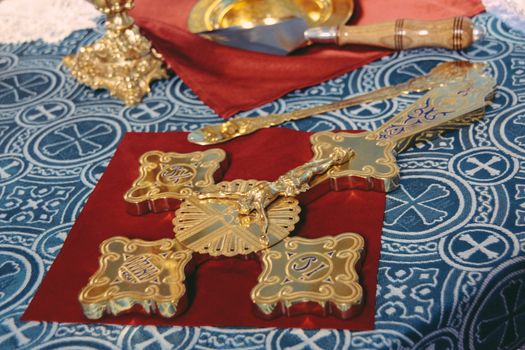 Orthodox cross on the table ceremony in christianity church. Shallow depth of field.