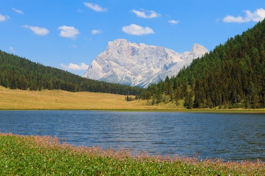 Beautiful alpine panorama, group Pala of dolomites from Calaita lake, Italian landscape
