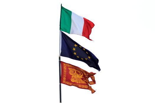 Three isolated flags waving in the wind, italy, europe