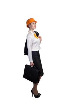 Young female engineer with suitcase in hardhat isolated on white