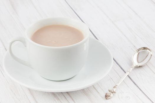 Cup of hot chocolate served in white dishware