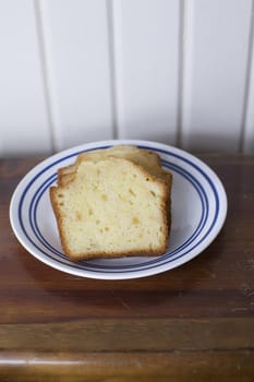 Three slices of pound cake on a small plate