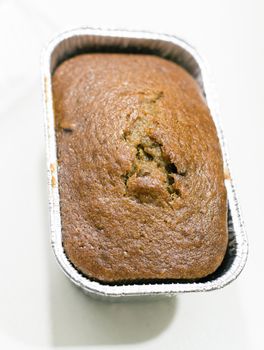 Whole pound cake in an aluminum baking pan