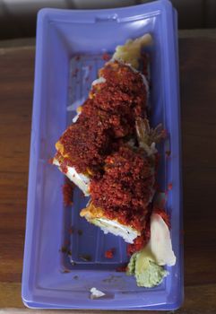 Close up of a roll of spicy shrimp tempura sushi