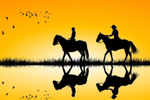 Silhouettes of two riders on horses standing together on sunset