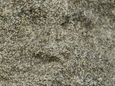 Surface of natural stone with outlines of face