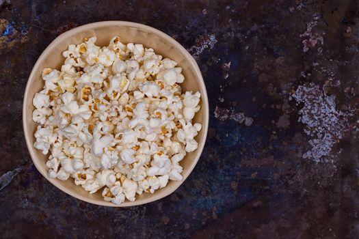 Popcorn in a bowl on a grunge background