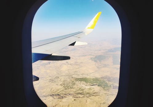 Airplane wing viewed from the aircraft window